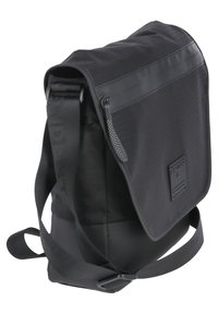 Black messenger bag made of textured fabric, featuring a flap closure, adjustable strap, and a front zippered pocket with reflective detail.