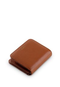 Brown leather wallet with a smooth texture, folded design, and gold embossed brand name on the front, featuring multiple card slots inside.