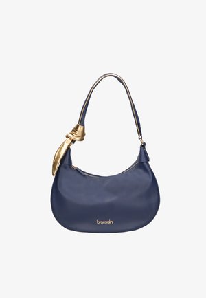 Sac à main en cuir bleu marine avec une seule lanière, fermeture éclair dorée, logo doré et un petit foulard doré attaché à la lanière.