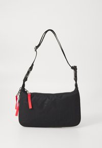 Black nylon bag with embossed 'DIESEL' logo, zip closure, and adjustable black strap. Features red zipper pulls and textured surface.