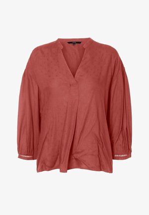 Rustfarvet bluse med v-hals, trekvartlange pufærmer og løs pasform. Har subtile teksturmønstre og dekorative detaljer på ærmerne.