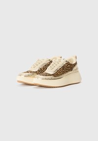 Leopard-print sneakers with a cream-colored synthetic upper, gold accents, thick platform sole, and textured laces.