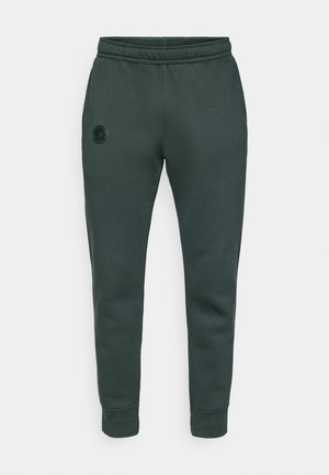 Dunkelgrüne, schmal zulaufende Sweatpants mit elastischem Bund und Knöchelmanschetten, ausgestattet mit einem kleinen runden Logo auf dem linken Oberschenkel.