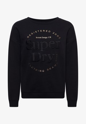 Sweat-shirt noir à manches longues avec « Super Dry » embossé au centre, entouré des inscriptions « Registered 2003 » et « Clothing Brand » en doré.