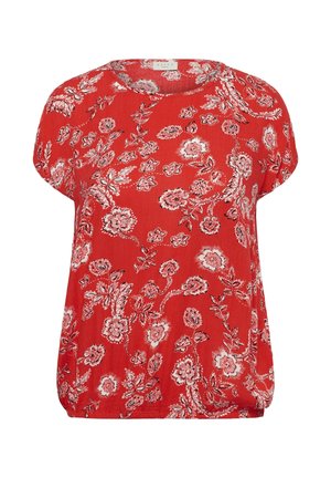 Blouse rouge à manches courtes avec motif floral blanc et noir et col rond.