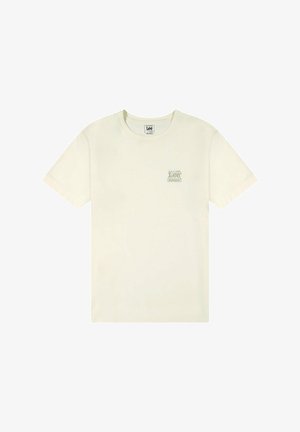 T-shirt color crema realizzata in morbido tessuto, con scollatura rotonda, maniche corte e un piccolo logo stampato sul lato sinistro del petto.