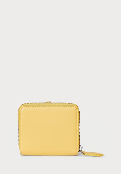 Yellow leather wallet with a square shape, zip closure, and a small tag attached. Smooth texture with no visible patterns or hardware.