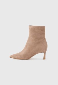 Beige suede ankle boots with a pointed toe and a low, slim heel. Smooth texture with a minimalist design, featuring no visible hardware.