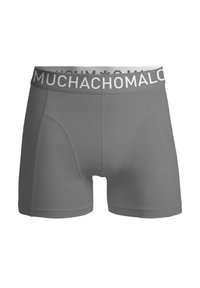 Szürke boxer alsónadrág rugalmas anyagból, fehér derékkal, amelyen a "MUCHACHOMALO" felirat olvasható vastag betűkkel.