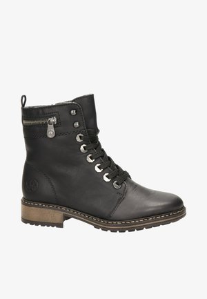 Bottines noires en cuir avec un bout rond, lacées à l'avant et avec une fermeture éclair sur le côté. Comprend des éléments en métal et une semelle en caoutchouc texturé.