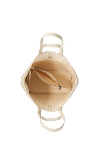 Sac fourre-tout de couleur crème avec deux poignées, présentant un compartiment intérieur spacieux et une poche zippée pour l'organisation.