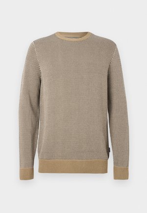 Sweater bege e castanho com um padrão quadriculado texturizado, gola redonda e punhos e barra canelados. Feito de material de malha macia.