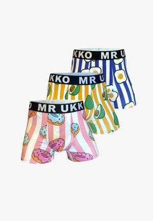 Tres pares de bóxers con rayas verticales y patrones de comida: rosa con donuts, amarillo con aguacates y azul con huevos fritos.