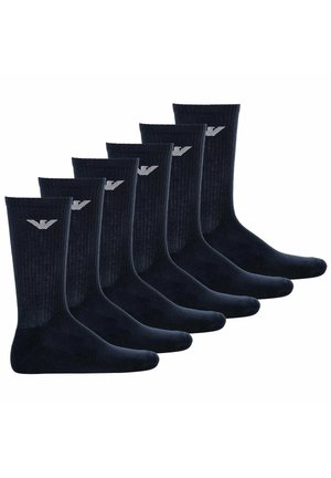 Six paires de chaussettes bleu marine foncé, design côtelé, texture lisse, avec un petit logo brodé en blanc. Chaque chaussette a une longueur débarbouillée.