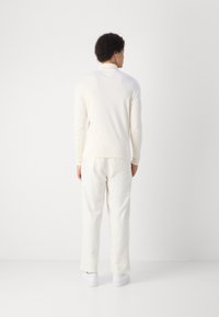 Tommy Hilfiger ROLL NECK TEE - Maglietta a manica lunga - ivory petal