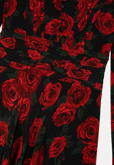 Black floral dress featuring red roses and green leaves, with pleated details and buttons on the bodice. Soft, flowing fabric texture.