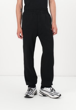 MARKY - Tracksuit bottoms - black