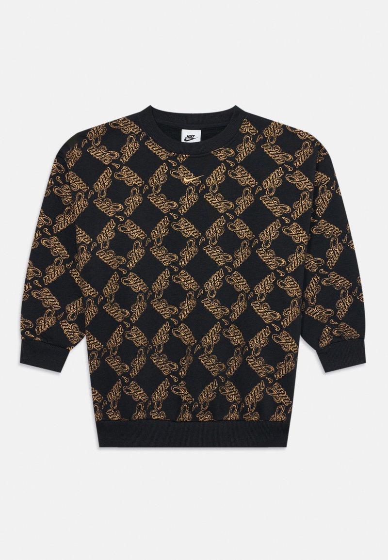 Fekete pulóver gyémántmintával, arany Nike logókkal. Bordázott mandzsetták és alsó szegély, kerek nyakú, puha kötött anyag.