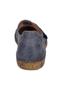 Navy leather shoe with textured back, brown patterned sole, and contrasting stitching details. Rounded shape and low-profile design.