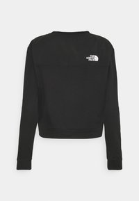 Sweat-shirt noir à manches longues avec le logo blanc The North Face sur le haut du dos, avec un col rond et des poignets et un ourlet côtelés.