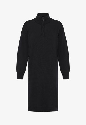 Fekete hosszú ujjú kötött ruha bordázott mandzsettákkal és szegéllyel, magas gallérral és fél cipzárral, amely kör alakú húzókarral rendelkezik a nyaknál.