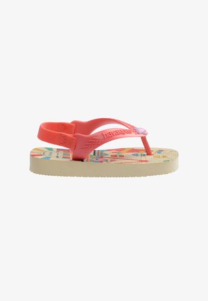 Chancla beige para niño con tiras rosa coral, una correa elástica en el talón y suela impresa colorida con diseños de dibujos animados divertidos.