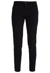 Pantalons en coton noir avec une coupe slim, fermeture à bouton et poches avant, présentant une texture lisse et des détails de couture minimaux.