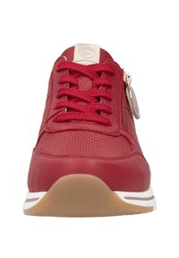 Red leather sneaker with perforated design, round toe, lace-up closure, side zipper, tan sole, and small logo detail on the tongue.