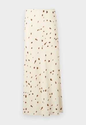 Longue jupe crème avec des taches irrégulières brunes dispersées, longueur cheville et coupe droite.