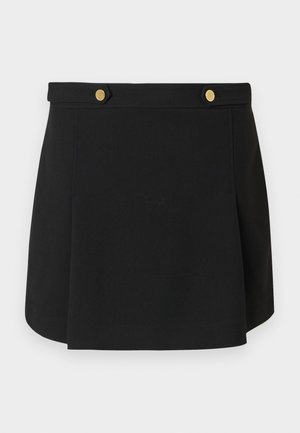Schwarzer Minirock mit einem taillierten Bund und zwei Goldknopf-Details an der Vorderseite, mit einem leichten Schlag am Saum.