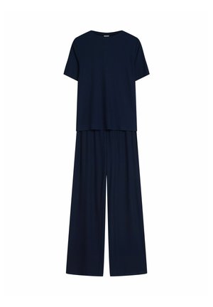 Navy-blaues Zweiteiler-Outfit mit einem kurzärmligen, lockeren Oberteil und weit geschnittenen Hosen aus geripptem Stoff. Durchgehend glatte Textur.