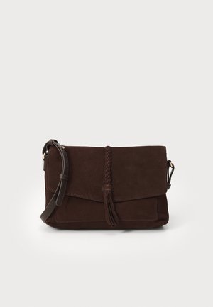 Brown suede handbag with a braided leather accent and tassel. Features a flap closure and adjustable strap for crossbody wear.