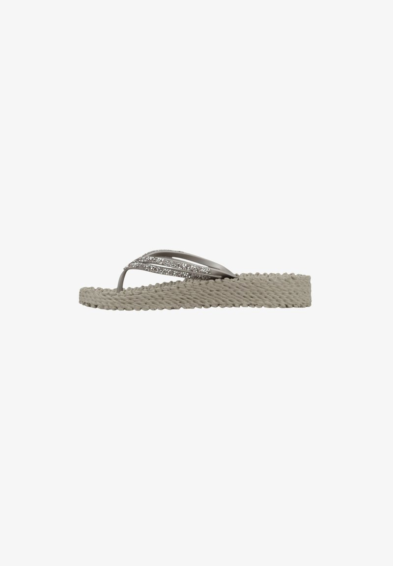 Šedé espadrilky s plochou podrážkou z pleteného lana, se dvěma tenkými pásky zdobenými malými třpytivými detaily. Ploché, pohodlné provedení.