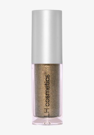 Liquid eyeshadow in a transparent tube with a silver cap. The color is a shimmery gold with fine glitter particles.