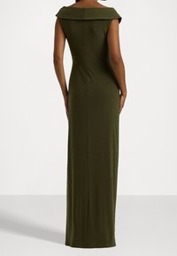 Long olive green dress with a fitted silhouette, off-the-shoulder collar, and smooth texture, featuring a sleek back design.