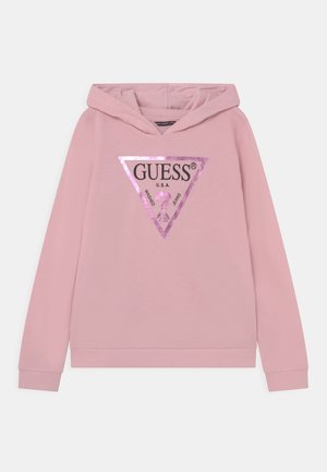 Jasnoróżowa bluza z kapturem z metalicznym różowym trójkątnym logo GUESS i napisem „U.S.A. Washed Jeans” z przodu.