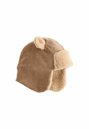 Ruskea corduroy-hattu, jossa on kermaisa tekokarvatrimmi ja korvaläpät, jotka on varustettu pyöreillä korvilla päällä. Rakenteellinen ulkopinta ja pehmeä vuori lämpöä varten.