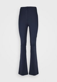 Pantalones acampanados azul marino hechos de un material elástico con una textura suave. Presenta una cintura ajustada y un diseño minimalista sin hardware visible.