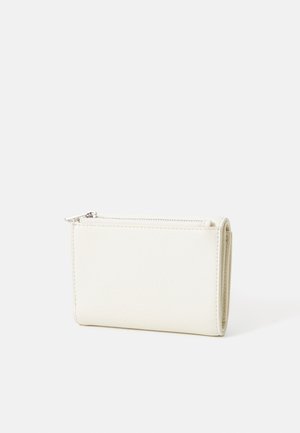 White leather wallet with a textured surface. Features a zip closure and compact rectangular shape. Minimalist design with no visible branding.