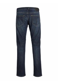 Blugi din denim de culoare bleumarin, cu croială dreaptă. Au cinci buzunare, cusături aurii contrastante și o etichetă din piele la talie.