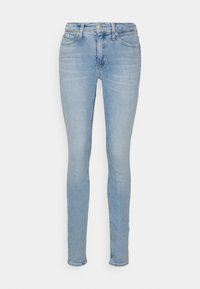 Jeans slim-fit di colore azzurro chiaro con chiusura a bottoni e zip frontale, cinque tasche e leggeri dettagli sbiaditi su cosce e ginocchia.
