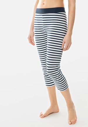 Striped leggings with a navy blue and white pattern, featuring a solid navy waistband and a cropped design that ends mid-calf.