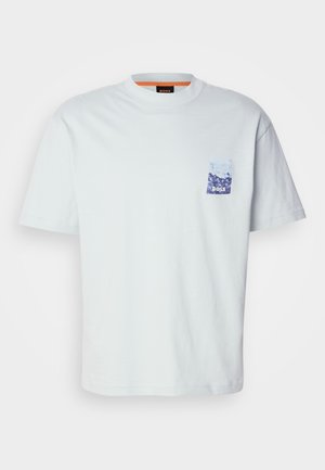 White short-sleeve t-shirt in cotton, featuring a small blue graphic pocket print with mountain design and the brand name "BOSS."