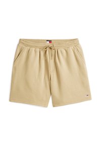 Beżowe bawełniane szorty z elastycznym paskiem w talii, sznurkiem, bocznymi kieszeniami i małym logiem Tommy Hilfiger na dolnym końcu.