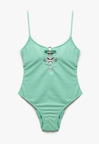 Un maillot de bain une pièce vert menthe avec un motif en écailles de poisson texturé, doté de bretelles réglables et d'un détail décoratif en découpe en forme de clé.