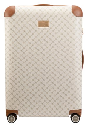 Hard-shell suitcase in cream with a subtle fan pattern, brown accents, a metal logo, and four wheels for mobility.