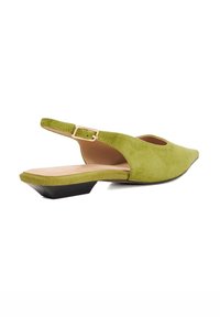 Green suede slingback shoe with a pointed toe, minimal silhouette, and a small black heel. Features a buckle detail on the ankle strap.