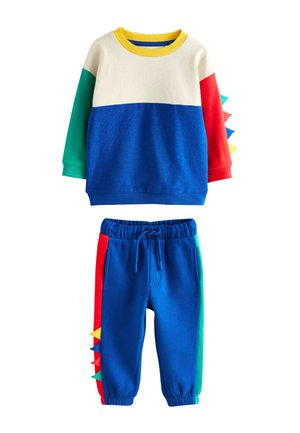 Børns todelte sæt med color-blocket sweatshirt og bukser i blå, rød, grøn og creme, med stofdinosaurtagger på siderne.