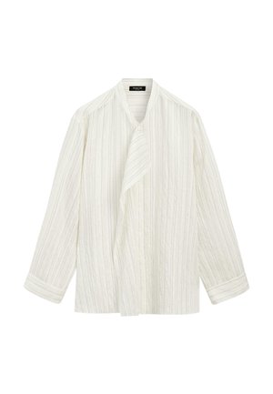 Blouse blanche à manches longues avec fines rayures verticales, panneau avant asymétrique et manches à revers.