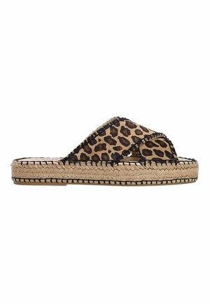 Leopard print slip-on sandals with crossover straps, jute woven sole, and black stitching details along the edges.